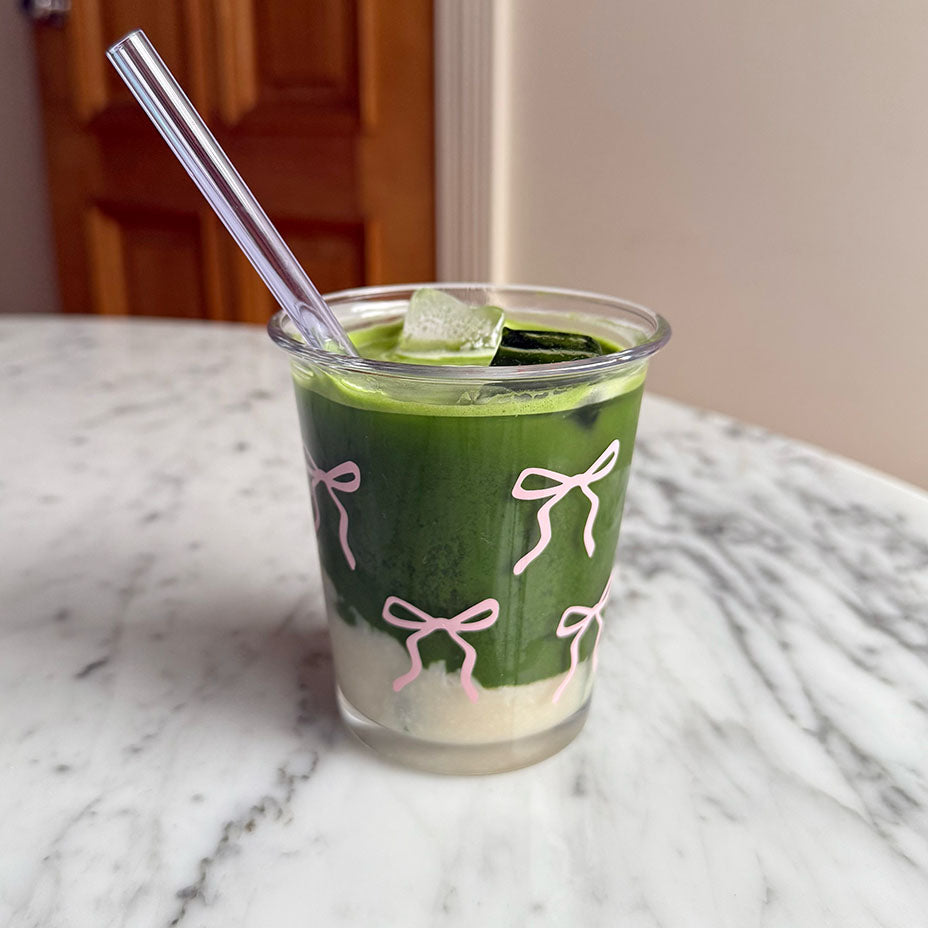Maison Matcha iced matcha latte in a cute glass with a straw before to be mixed