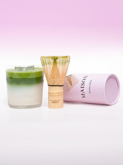 Maison Matcha matcha latte with matcha whisk and pink cylinder box