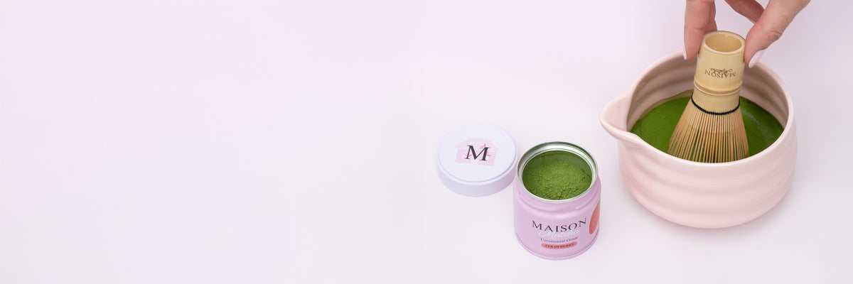 Maison Matcha strawberry can opened next to matcha whisk in bowl