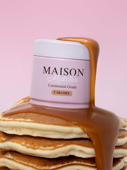 Maison Matcha Ceremonial Caramel Matcha can on top of pancake stack with caramel sauce dripping