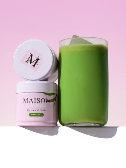 Maison Matcha ceremonial grade original matcha latte in a glass next to the 30g can, best ceremonial matcha powder in australia