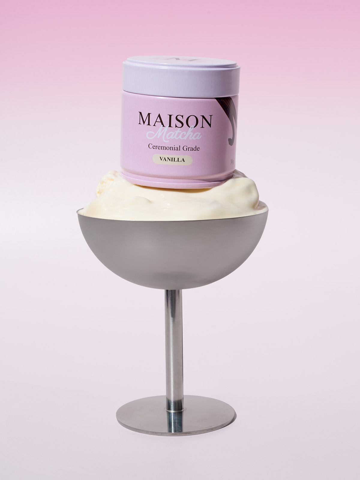 Ceremonial Vanilla Matcha can displayed on silver cup filled with vanilla ice cream